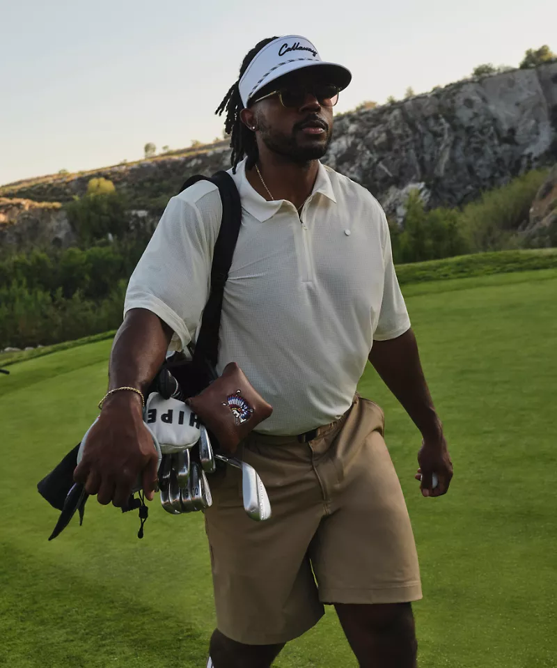 Ambassador Roger Steele lines up a drive while wearing new lululemon golf gear.