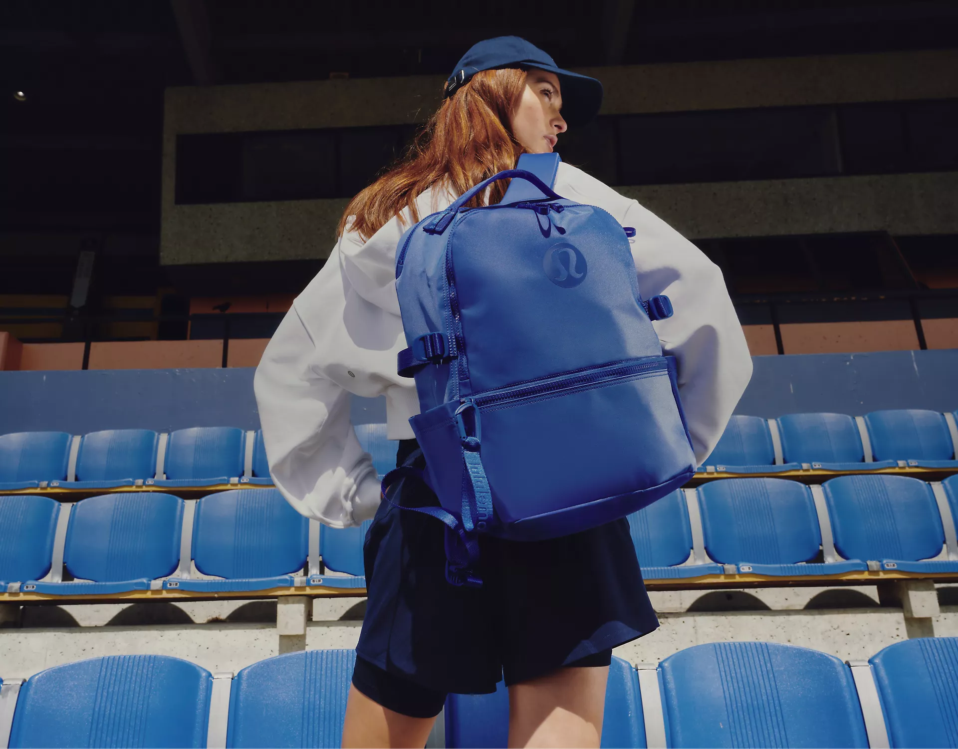 A person carries a New Crew backpack.